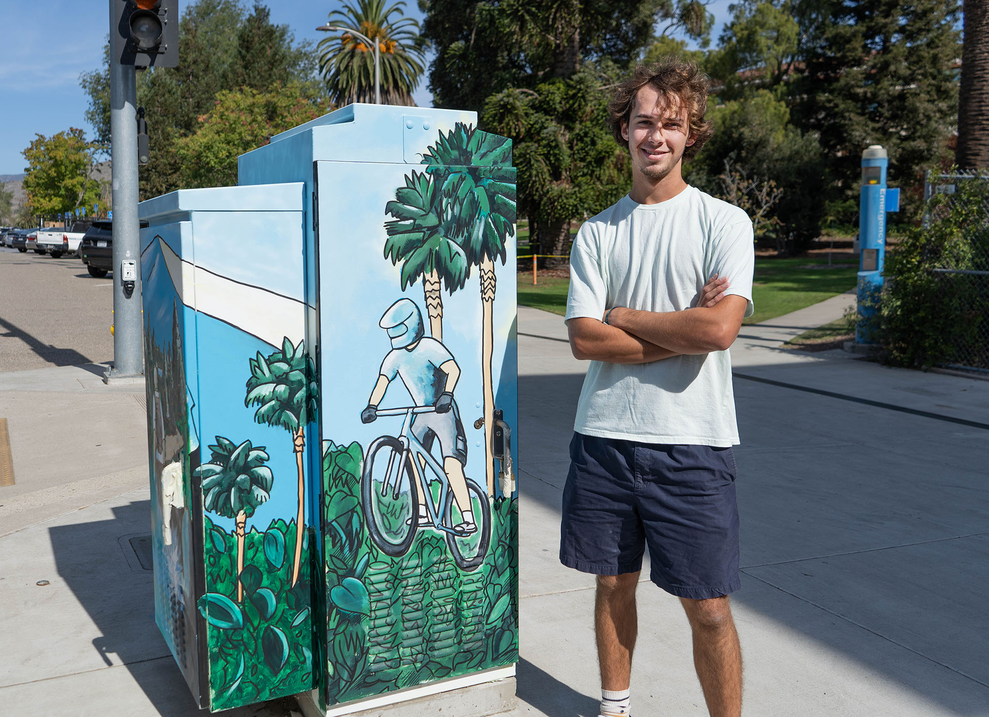 Guy standing next to the utility box