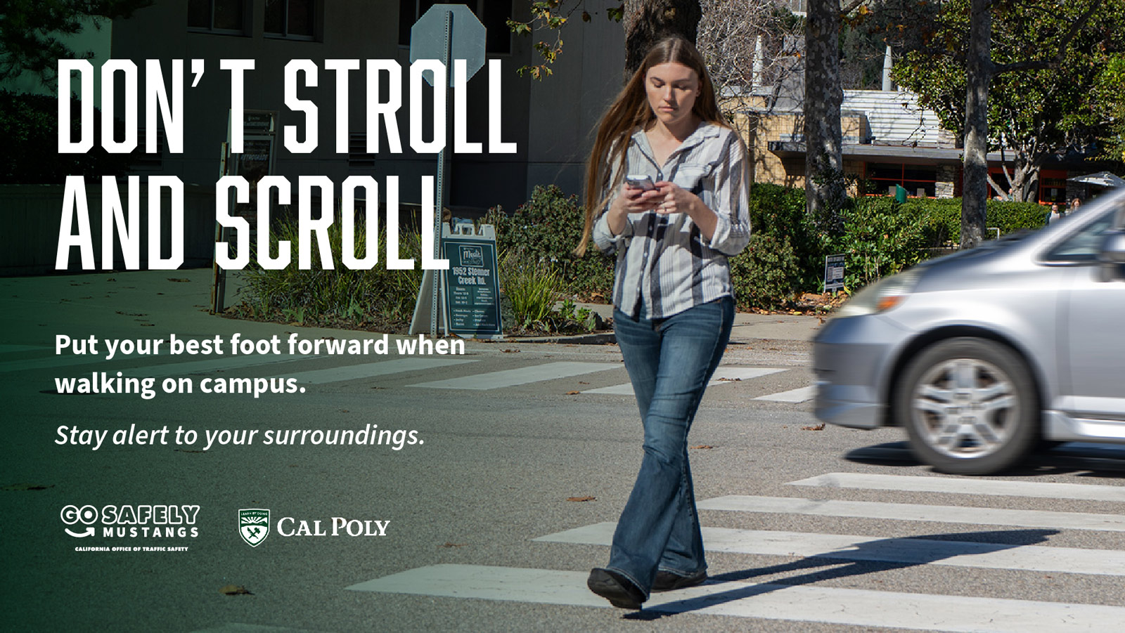 A student crossing the street while looking down at a phone. Text reads 'Don’t stroll and scroll'.